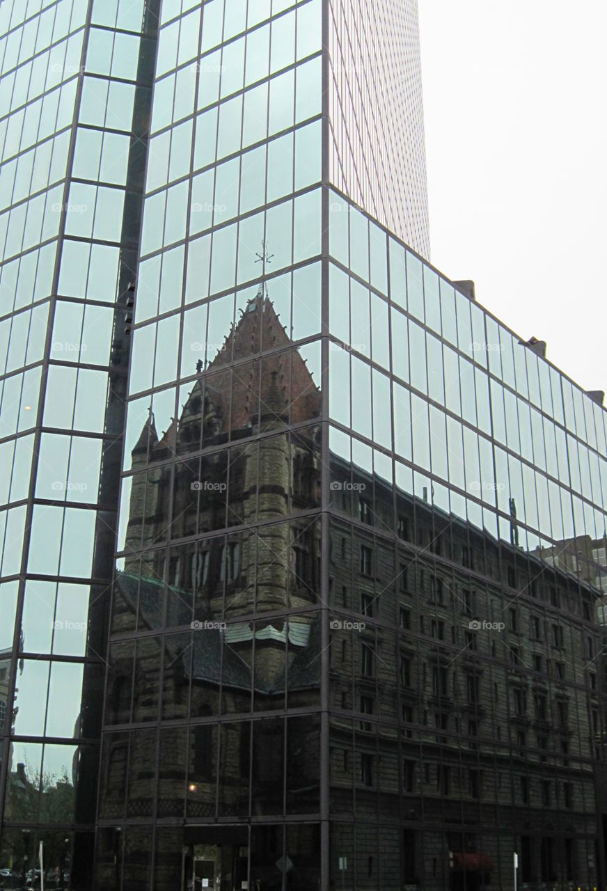 cathedral reflection over glass building