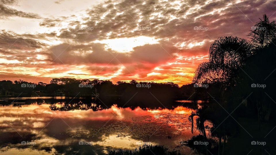 illuminous sunrise over lake