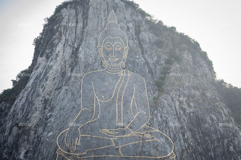 Buddha Sculpture on the mountain in Thailand