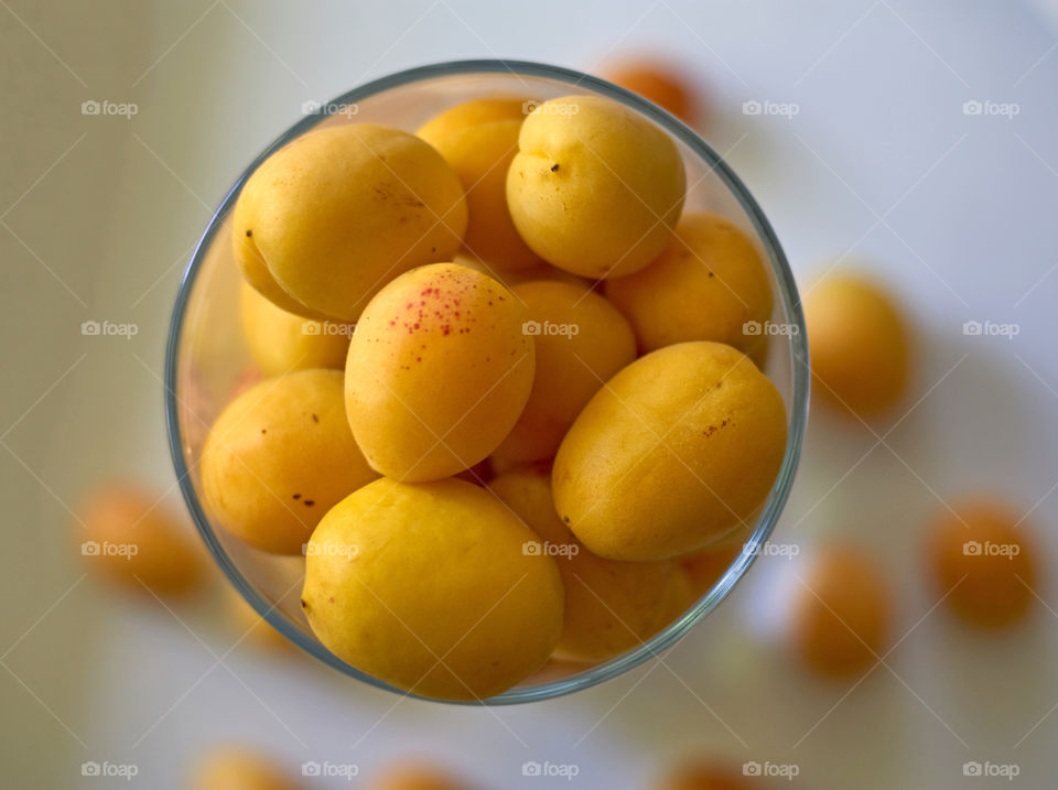 apricots in a vase on the table