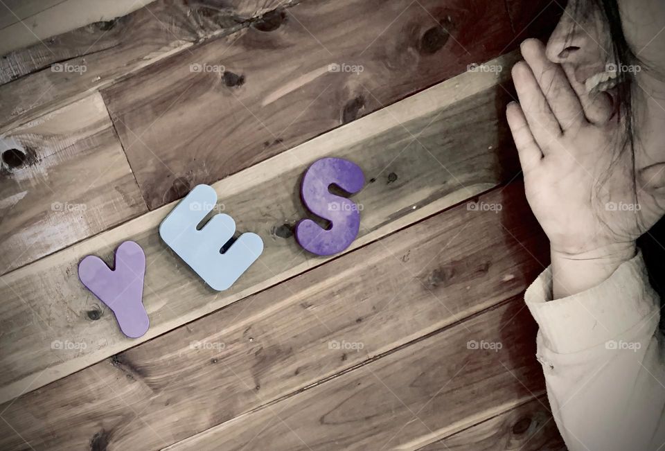 YES Word On A Wooden Wall As If The Woman Yells The Word With Happiness With Kids Foam Letterings 