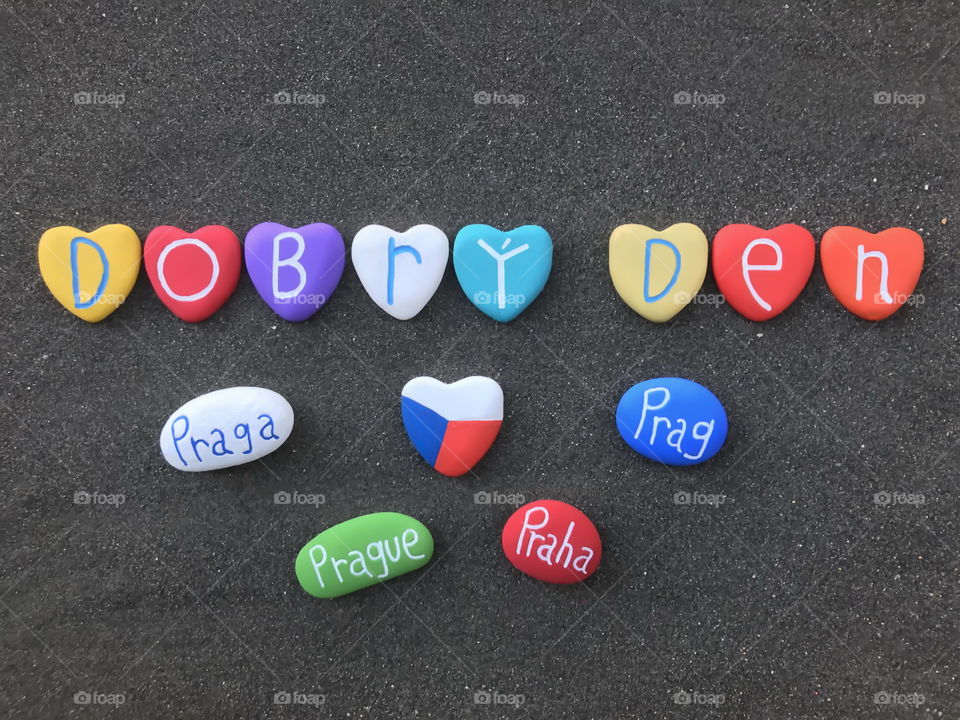 Dobrý Den Praha, Good Morning Prague, souvenir with colored heart stones over black volcanic sand