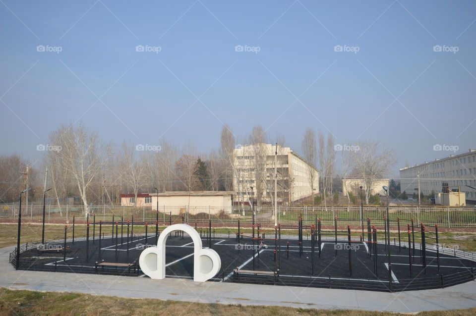 small stadium sports ground against the backdrop of city sports houses