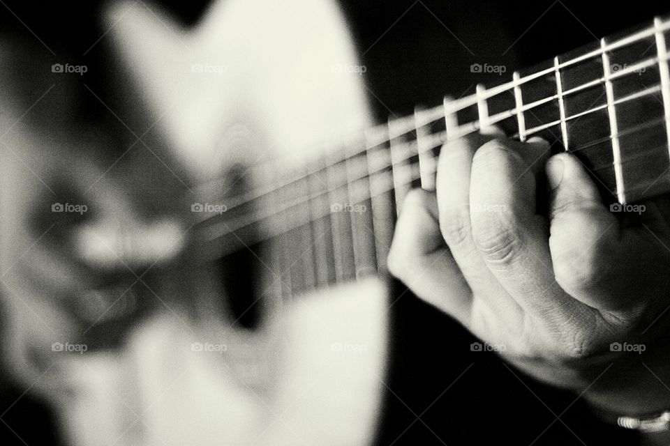 Hand on classical guitar 