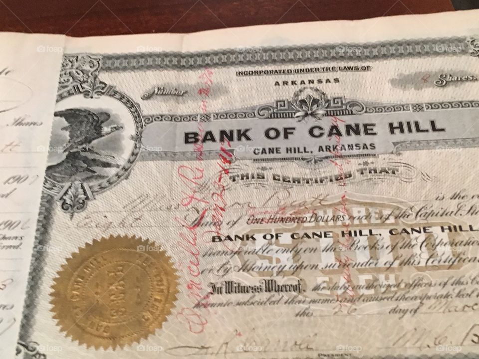 Certificate of the bank of Cane Hill tells that this person has 8 shares. Bank note