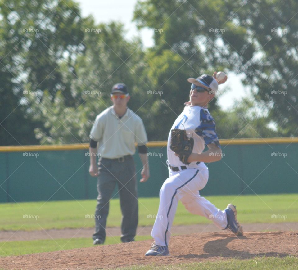 Pitcher throwing baseball