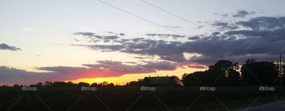 burning sky. sunset bowManville