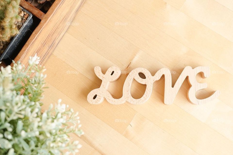 Love letters, wooden letters on the wooden table. Love and romantic concept.