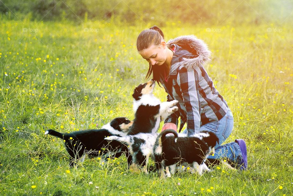 Young woman with puppies