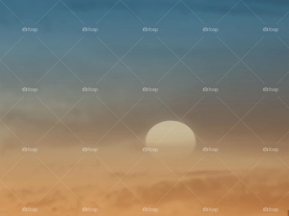 Aerial sunset through atmospheric clouds.