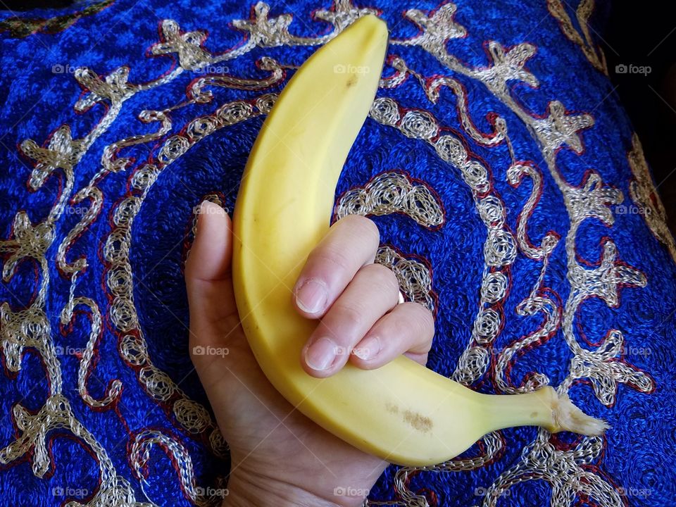 Holding banana