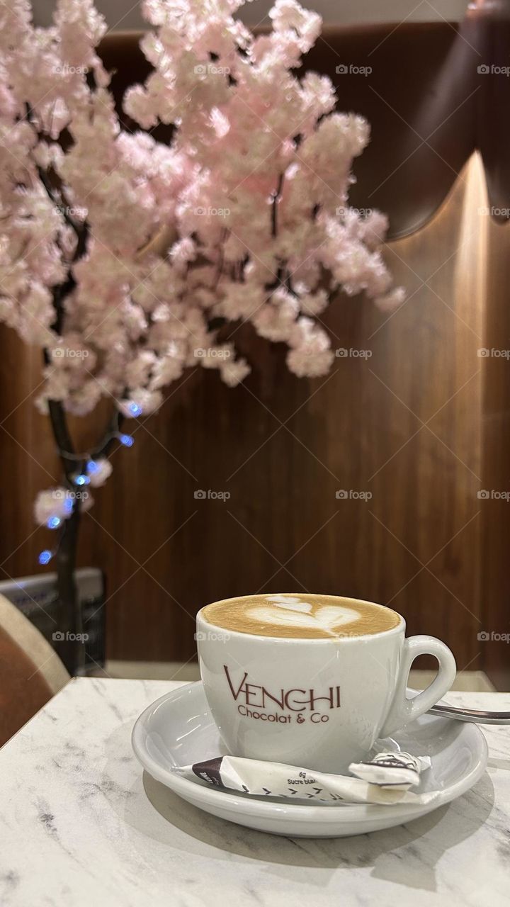 Art latte Coffee with spring pink tree 