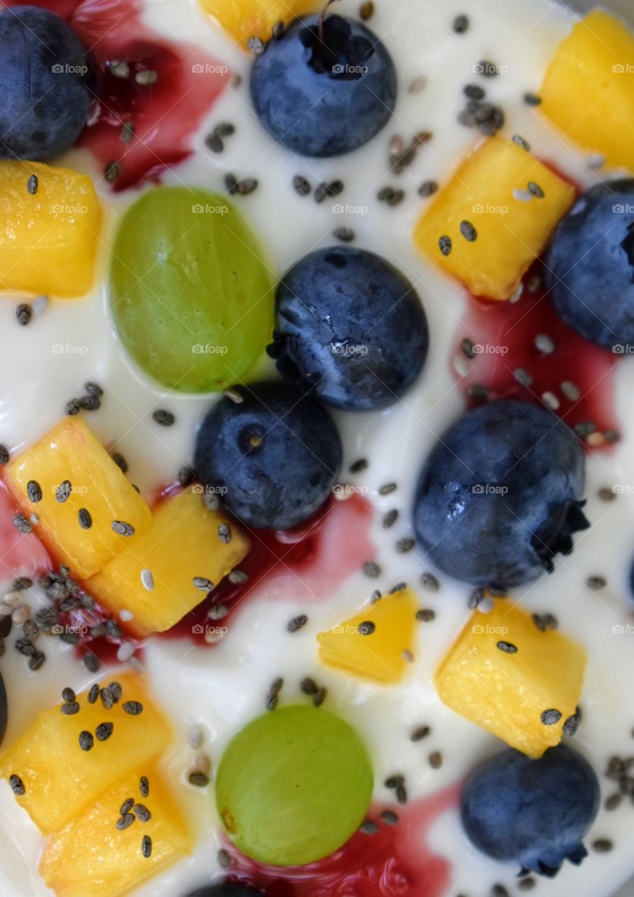 Delicious fruits on top of yogurt