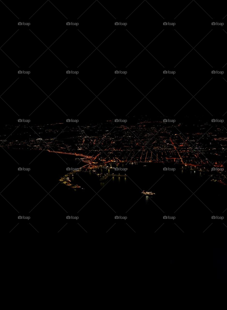 Night photography of a city/ nightlife from a plane /a city in Italy from a far /Night photo from an airplane