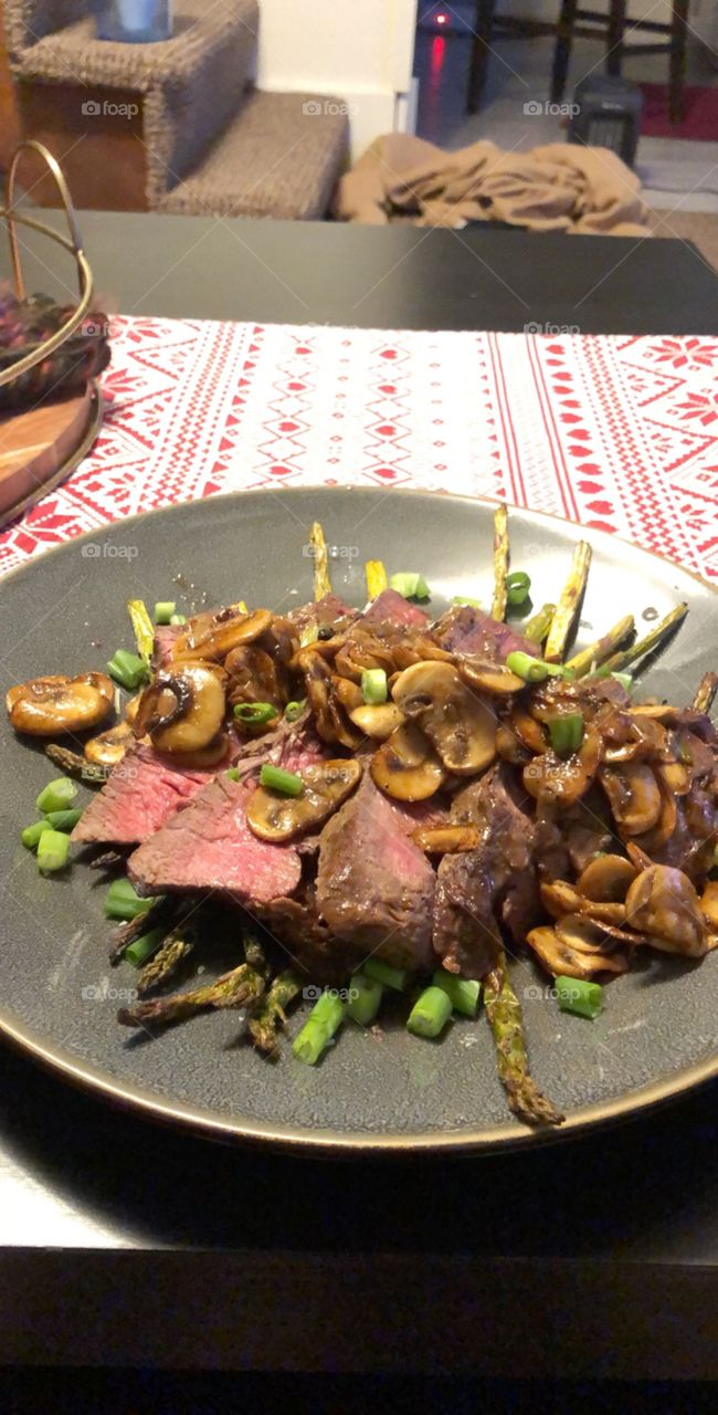 Asparagus, steak, and mushrooms completed with a delicious demiglaze. 