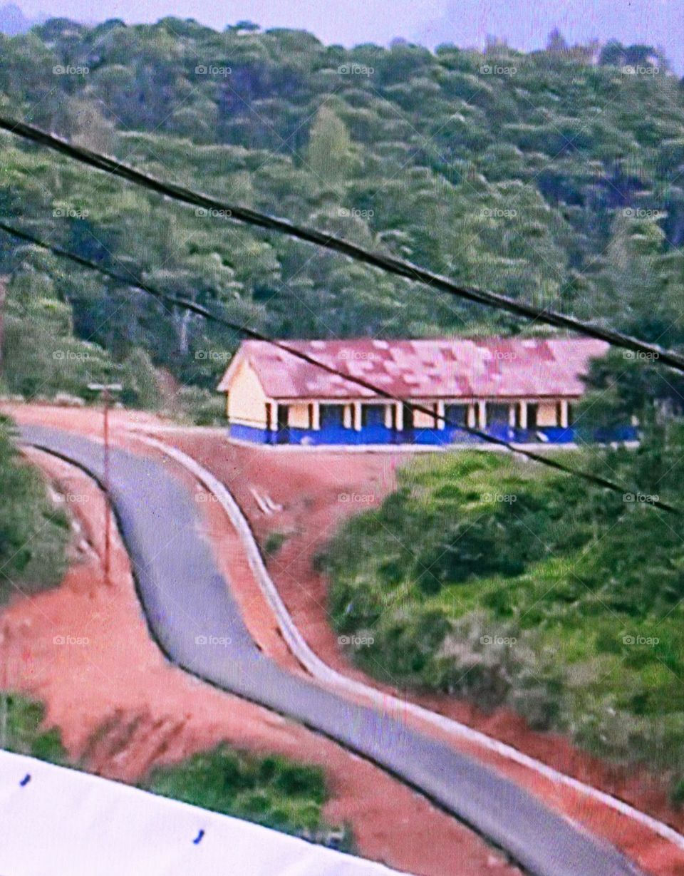 the beautiful arrangement, the new school building and the newly made asphalt road will make it easier for students to go and return through the road so that there are no more obstacles