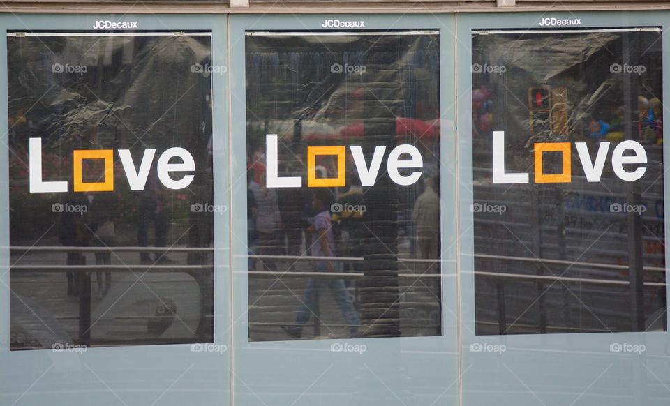 A billboard on street in Barcelona, Spain reads "Love Love Love".