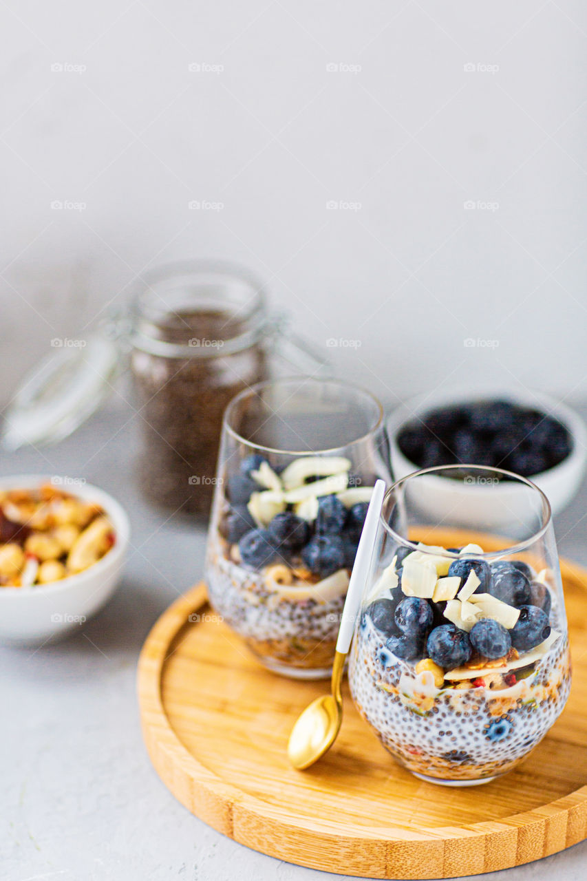 Chia pudding with fresh blueberries on table 
