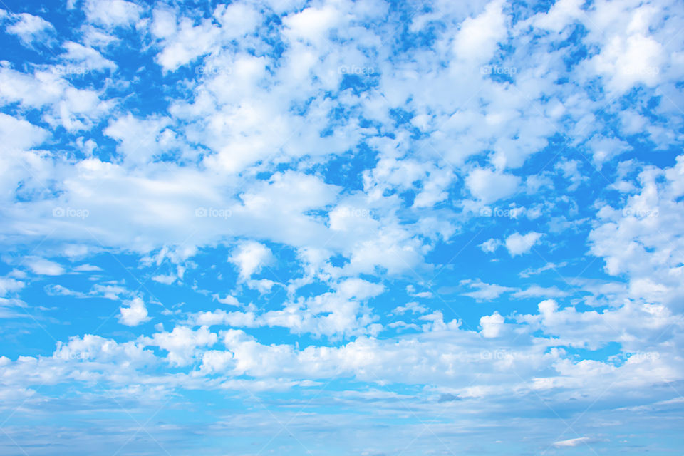 The beauty of the sky with clouds and the sun.