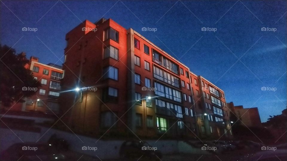 Building brick illuminated sunset