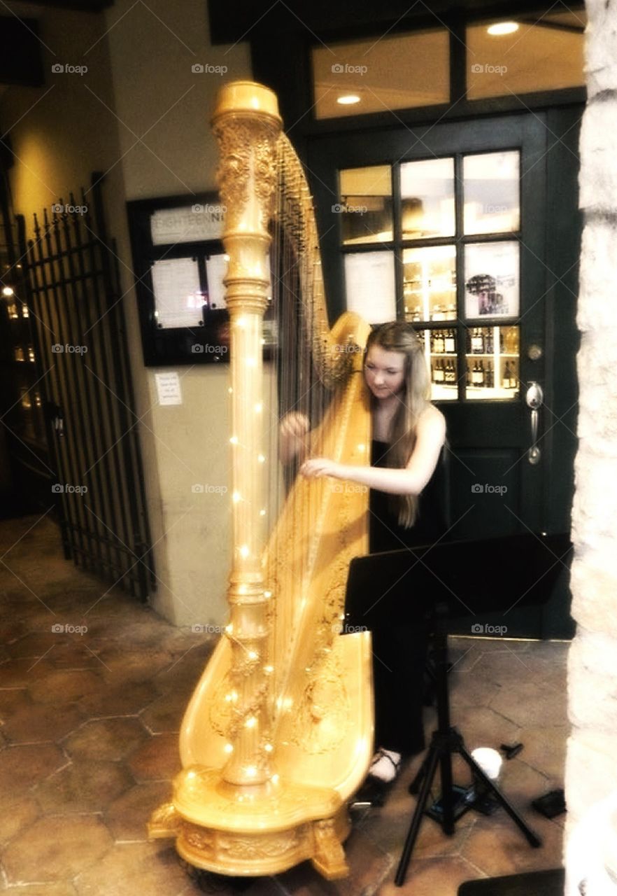 Girl playing Harp