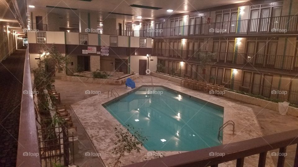 Indoor pool at a retro hotel.