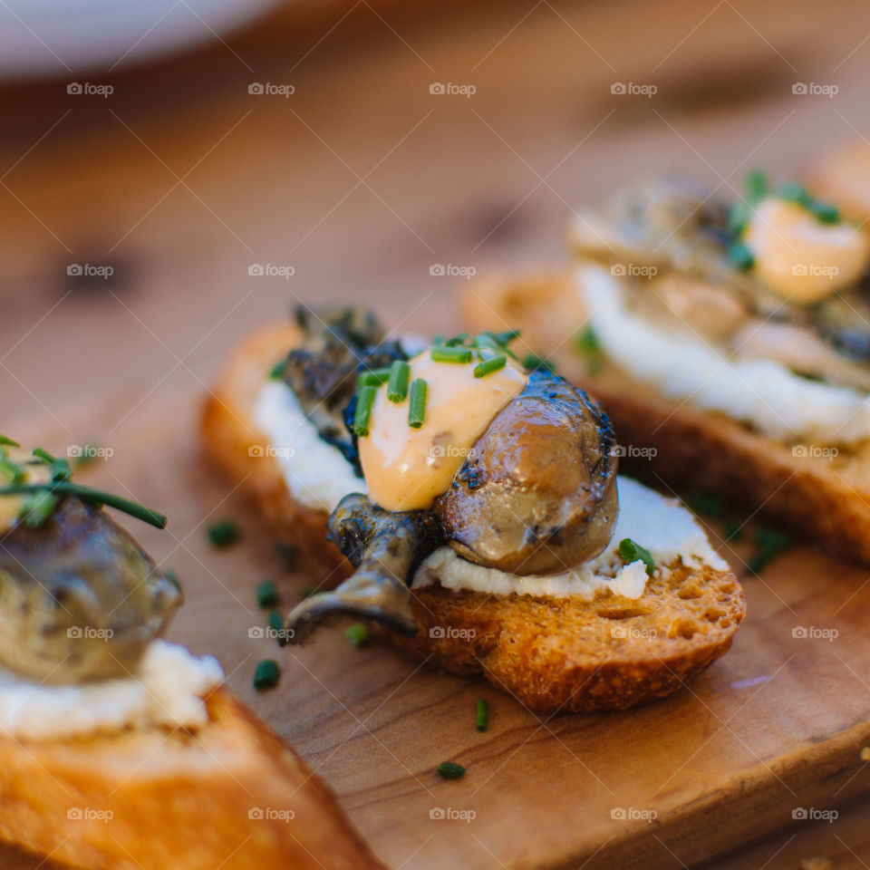 Smoked oysters on crostini