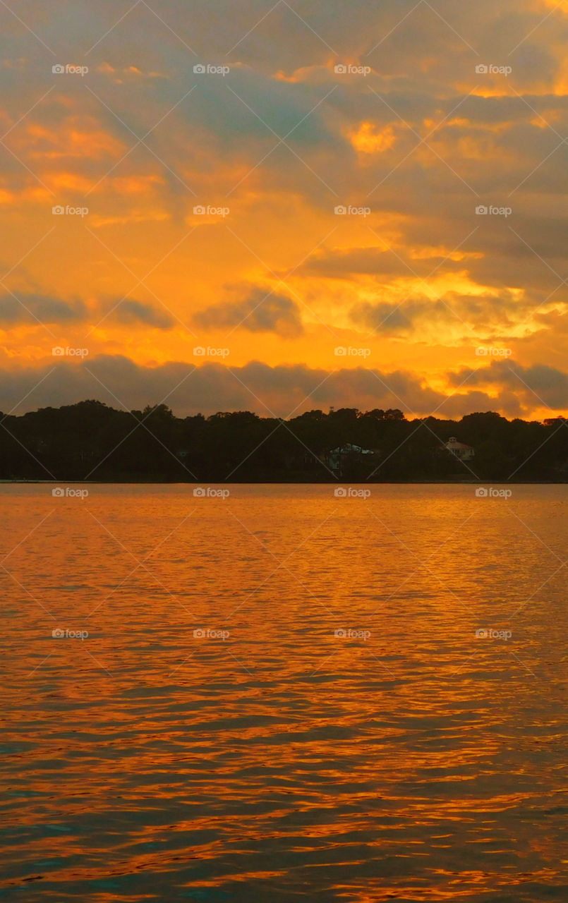 The sky was filled with the most brilliant orange complimented perfectly with hues of gold, yellow, red and crimson. An orange haze had casted over the water, reflecting off every wave. Finally,the sun disappears along with the shine. I can only wait to see another magical moment of beauty and warmth! I can only wait for another sunset! Enjoy!