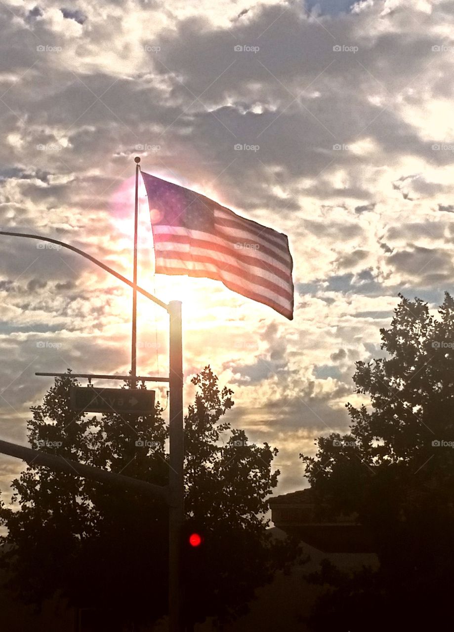 red white and blue. driving by, got this huge flag as sun was beginning it's descent