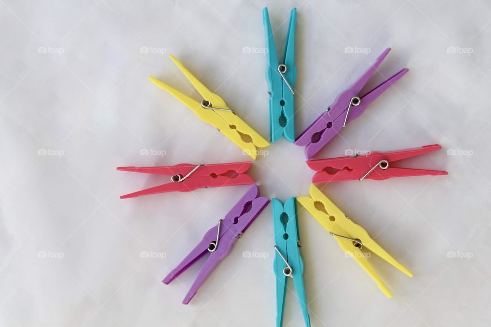 Colorful clothespin aligned in circular shape