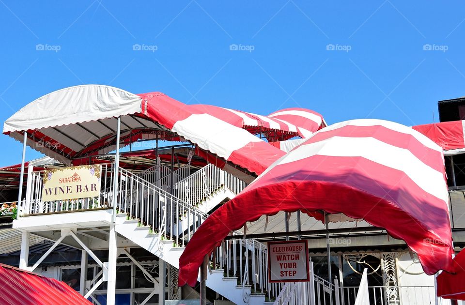 Stairway to Heaven. Saratoga's iconic red and white awnings that cover the stairway to the oldest clubhouse in America.
Fleetphoto