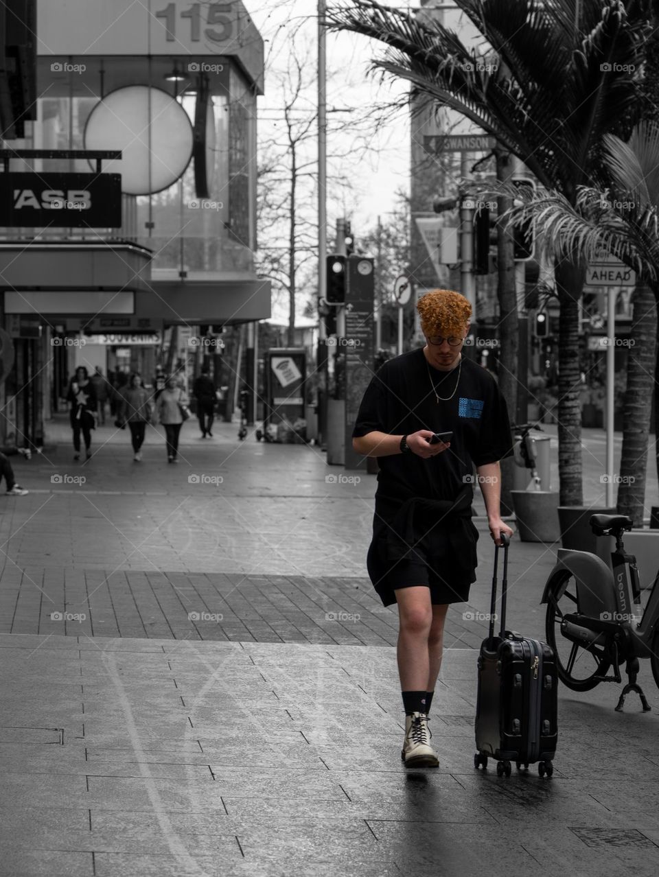 Stylish man walking on the sidewalk