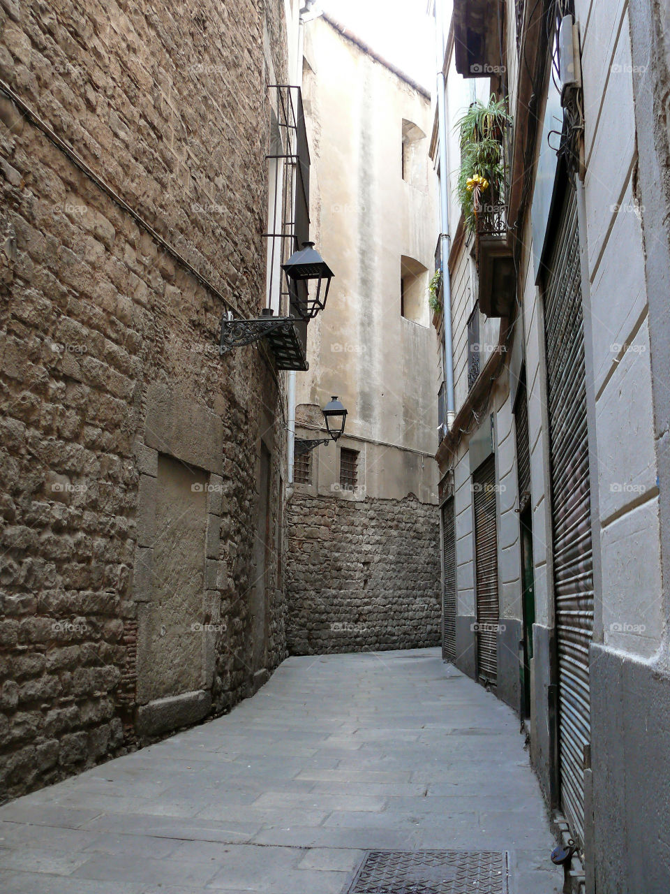 Alley amidst buildings in Barcelona, Spain.