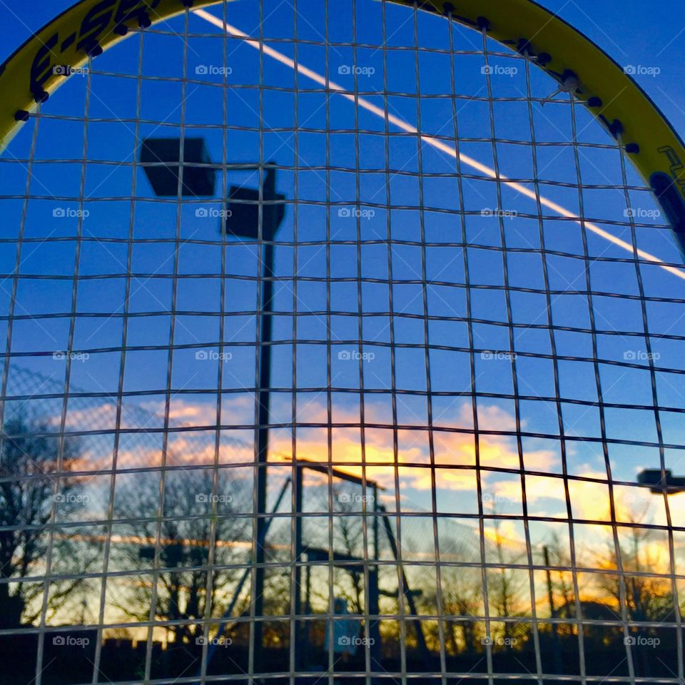 Sunset captured through my tennis racket 