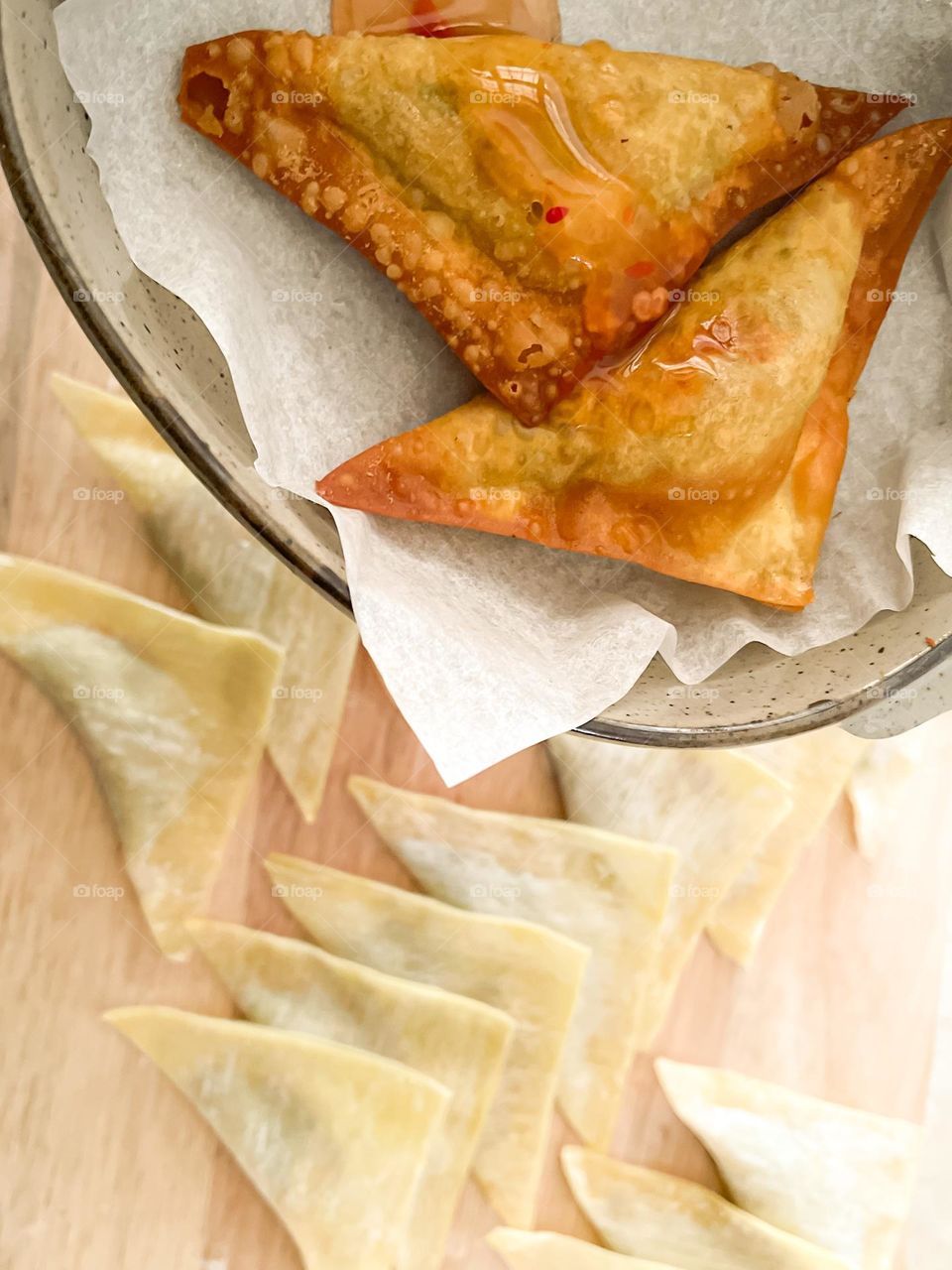 Easy dumplings folding in close up view. Top view showing the cooked and uncooked dumplings