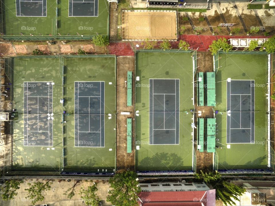 high angle view above tennis courts from drone