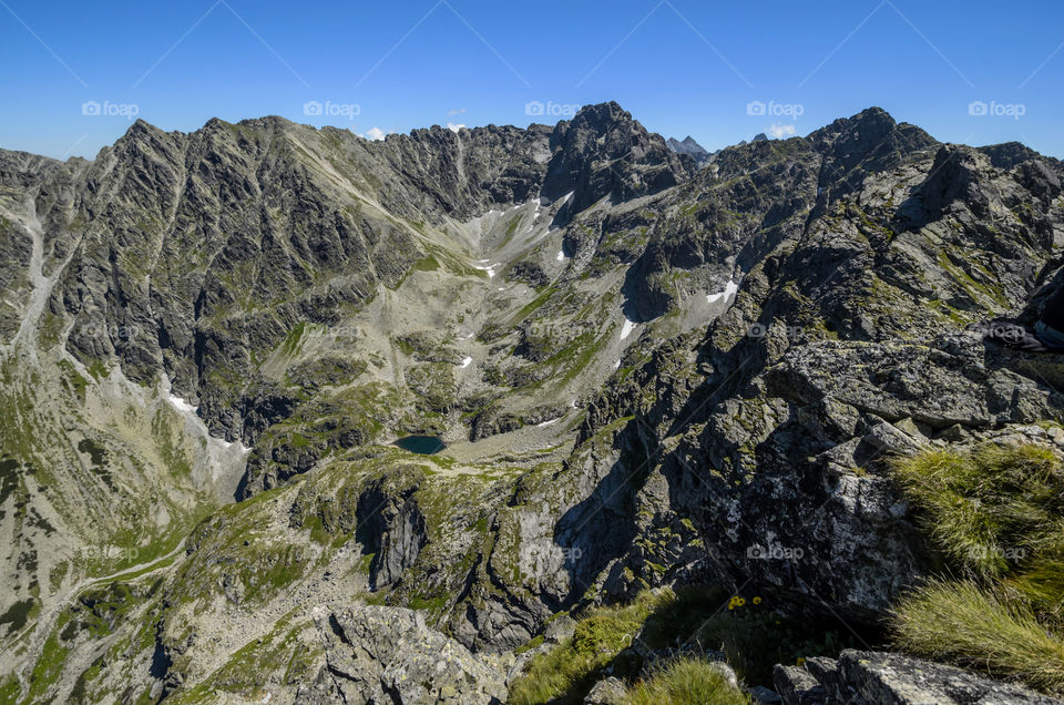 Summits sorroundigs Dolina Gasienicowa valley and Czarny Staw lake in High Tatras, Poland.