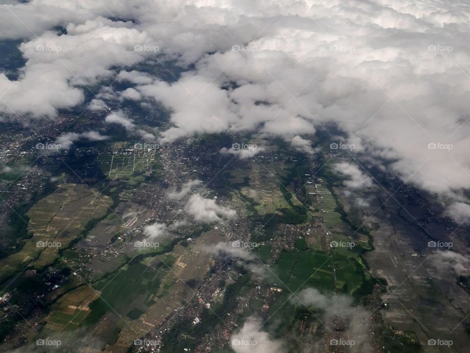 A land and coulds seen from the top view or sky