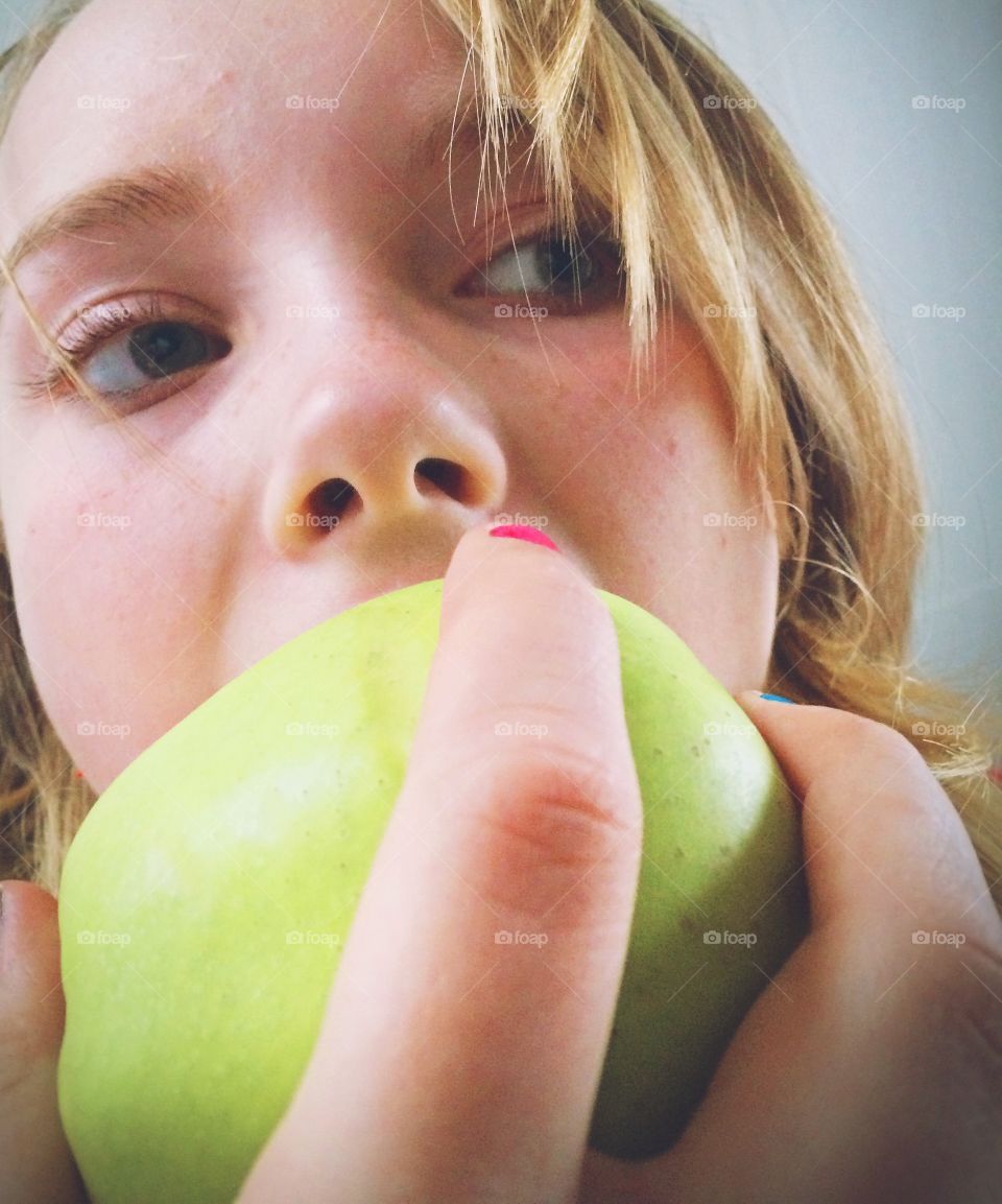 Girl eats a apple