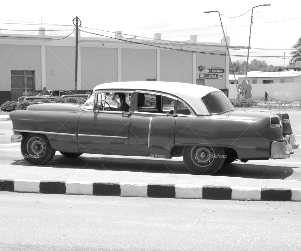 Cuba: Cadillac! As I see Santiago de Cuba in black and white, and sometimes in color! Cuba is a special destination and people know how to enjoy themselves, despite obvious signs of poverty and hardships. The streets are filled with vibrant colors and rhythm and it is not uncommon to see people dancing in the streets and alleys to the sound of loud salsa music! Wish I could, but It's impossible to capture it all!