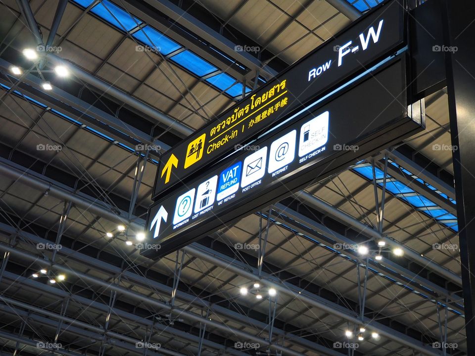 A sign board in a passenger terminal of an international airport.