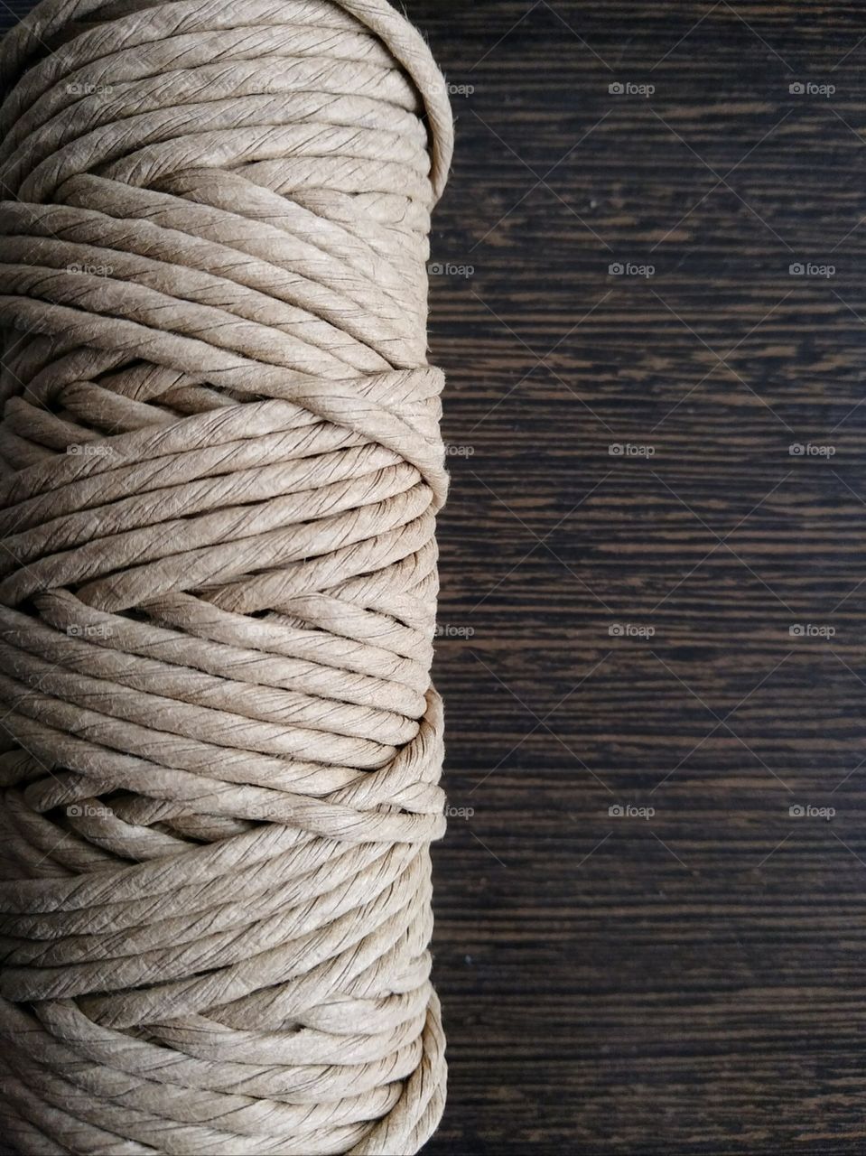 Paper rope on wooden table. Texture.
