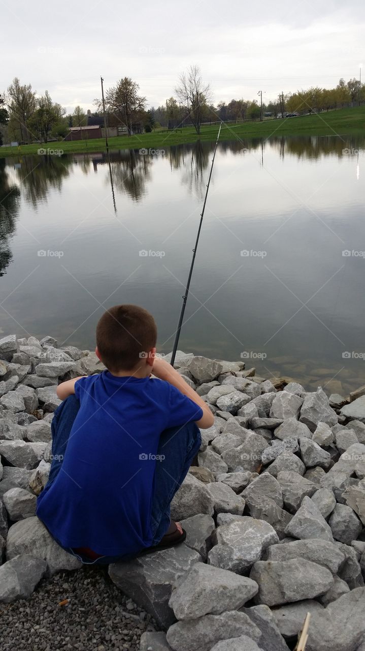 Boy fishing. First time fishing solo.