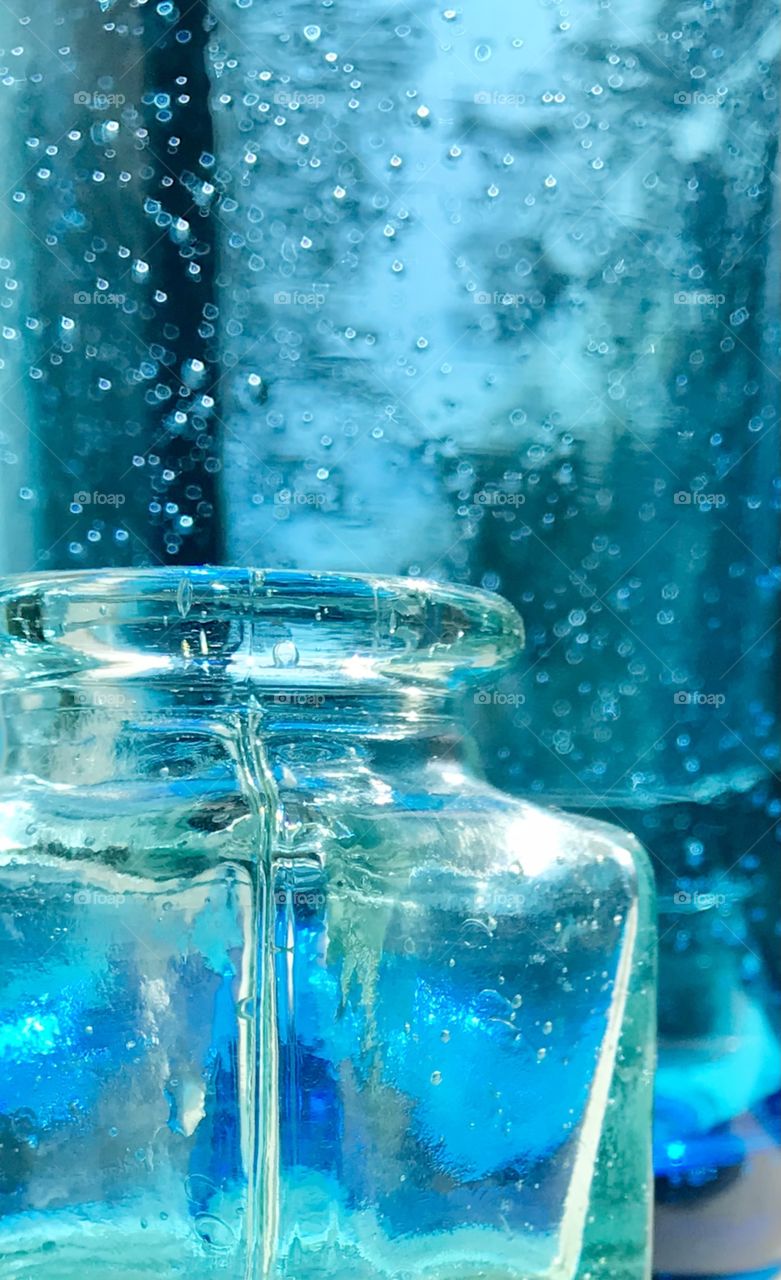 Blue glass on windowsill 