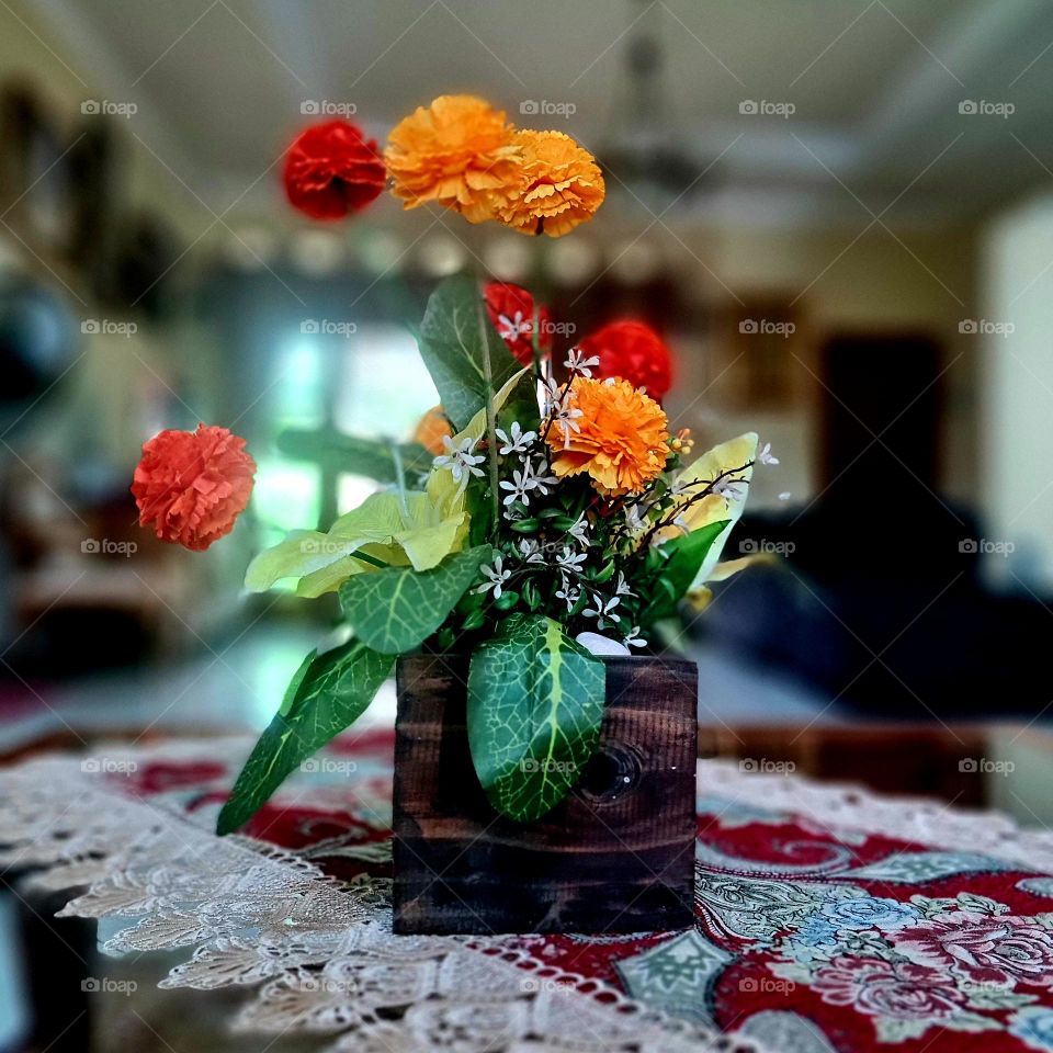 FLOWERS IN THE TABLE