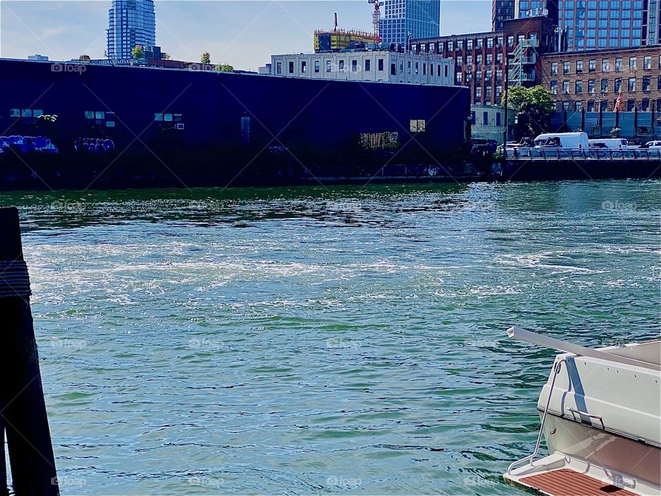This movement of water is called a wake. It occurs when a heavy vehicle passes by at great speed as was the case here at “Newtown Creek” by the “Pulaski Bridge” in LIC, Queens when a very large commercial barge drove by. 2023. Hypnotic Productions