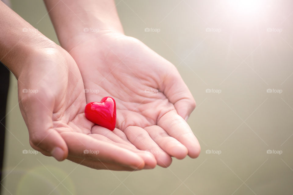 candy heart in hands for you love