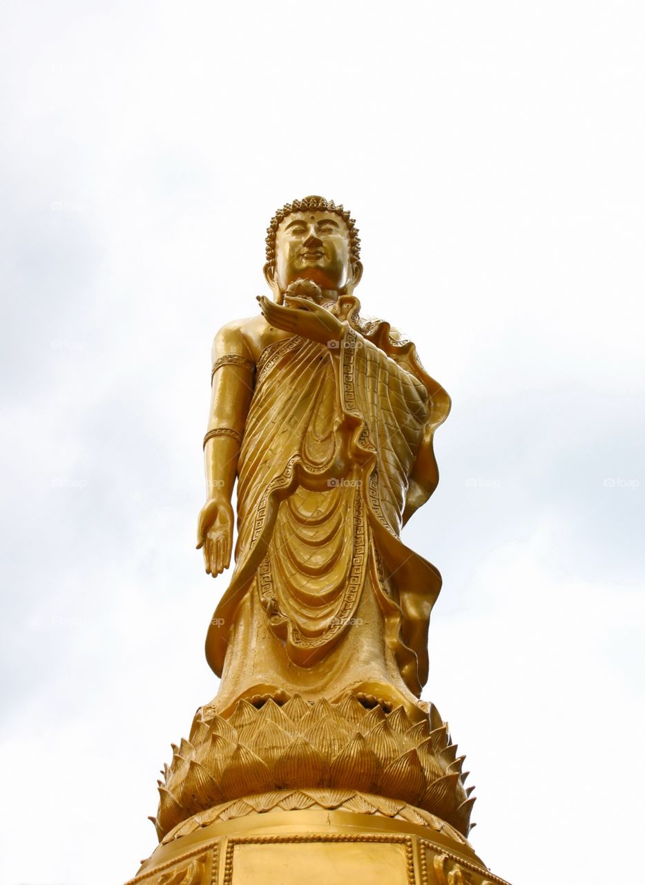 Golden standing big buddha in Phetchaburi, Thailand 