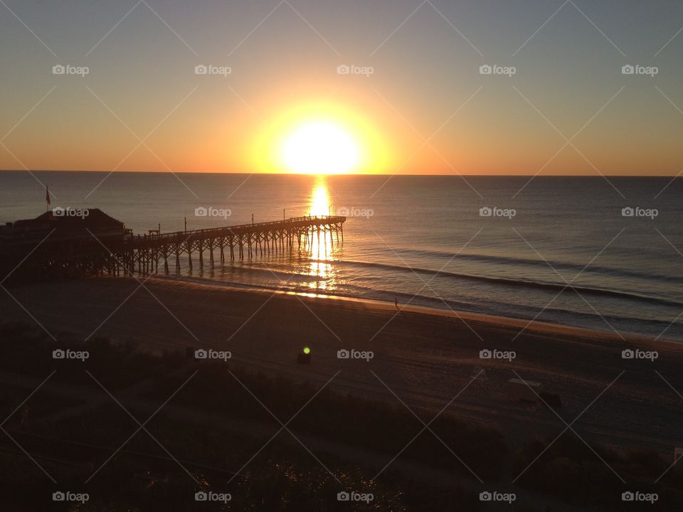 Sun rose. A perfect sunrise in Myrtle beach South Carolina at the boardwalk . 