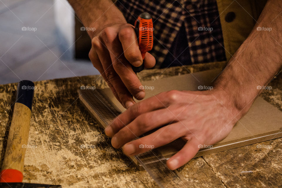 Close-up of a person cutting frame
